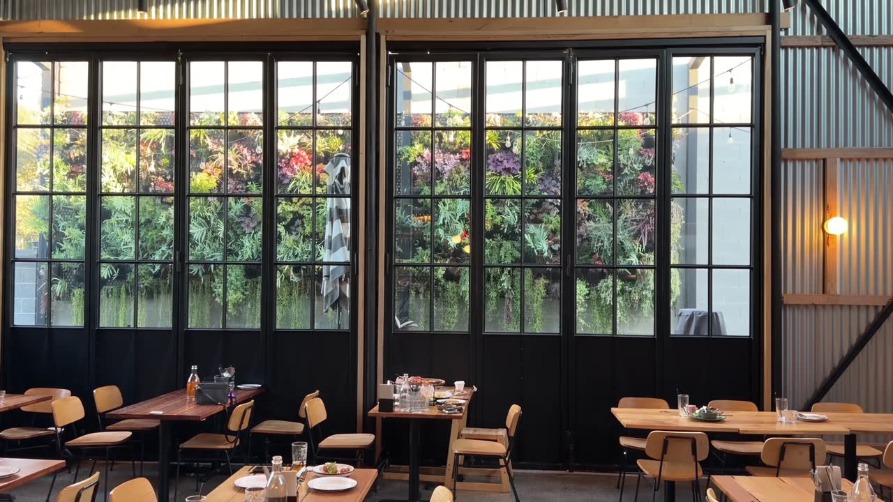 Main Dining with the vertical garden through the windows